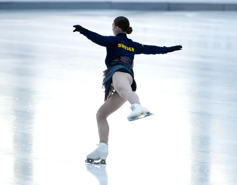 Ice skater landing on ice with shock absorbing blade, from sweden.