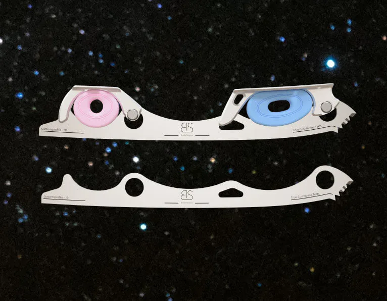 Shock Absorbing figure skating blade with two shock absorbers, pink and blue.